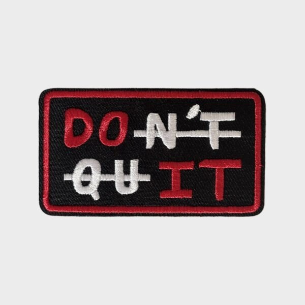 Black and red embroidered patch reading Don't Quit