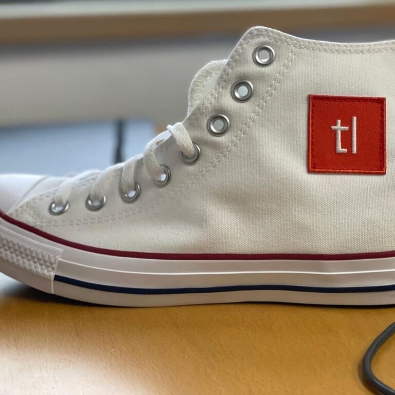 A white canvas high-top with the Techleap patch applied to the side